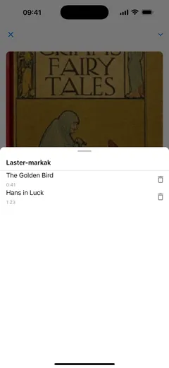 Fablumen audio-liburuen erreproduzitzailearen laster-marken zerrenda iPhonen: kapituluaren izena daramaten bi laster-marka, «Urrezko txoria» 0:41ean eta «Hans zorionekoa» 1:23an, bakoitza ezabatzeko botoiarekin