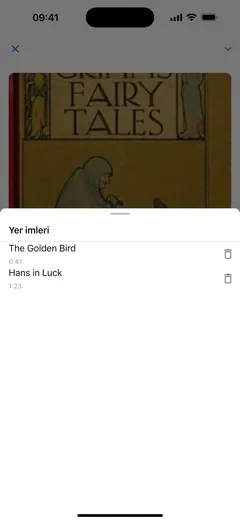 Fablum’un sesli kitap oynatıcısındaki yer imi listesi: bölüm adlı iki yer imi, 0:41’de “The Golden Bird” ve 1:23’te “Hans in Luck”, her birinde bir silme düğmesi